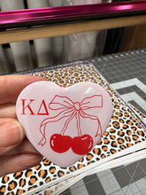 Load image into Gallery viewer, Heart Shaped Pin Back Button Kappa Delta Pink Heart with Coquette Cherries