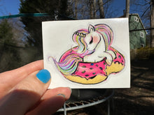 Load image into Gallery viewer, Sticker | 40i | Unicorn in Donut Float | Waterproof Vinyl Sticker | White | Clear | Permanent | Removable | Window Cling | Glitter | Holographic