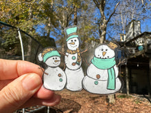 Load image into Gallery viewer, Sticker | 26C | 3 Snowmen | Waterproof Vinyl Sticker | White | Clear | Permanent | Removable | Window Cling | Glitter | Holographic