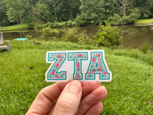 Load image into Gallery viewer, Sticker | ZTA_G | Zeta Tau Alpha | Waterproof Vinyl Sticker | White | Clear | Permanent | Removable | Window Cling | Glitter | Holographic