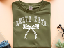 Load image into Gallery viewer, Comfort Colors Tee Delta Zeta Lace Bow Available in S M L XL